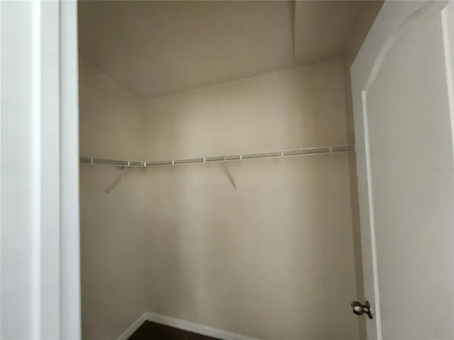 a bathroom with a white toilet and a shower