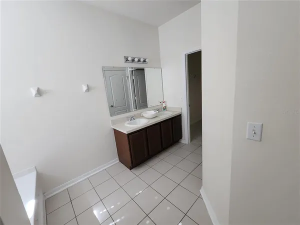 a view of an empty room and a window