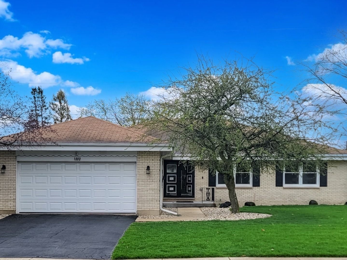 1003 West Hintz Road Arlington Heights, IL 60004 - Photo 1 of 27 a front view of house with yard