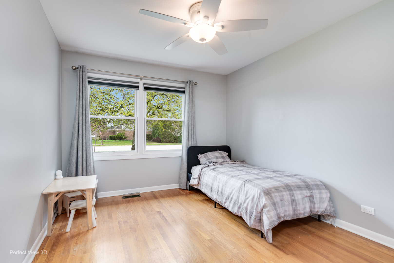 1003 West Hintz Road Arlington Heights, IL 60004 - Photo 15 of 27 a bedroom with a bed and a chair