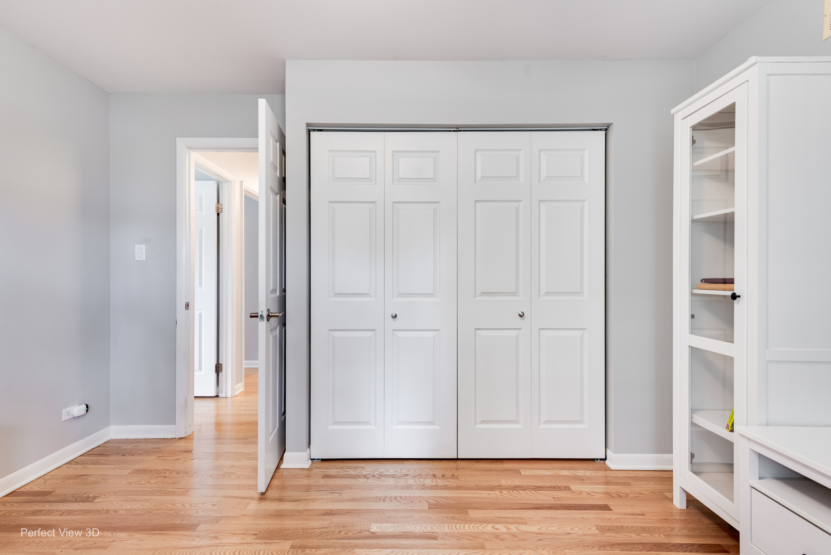 1003 West Hintz Road Arlington Heights, IL 60004 - Photo 17 of 27 an empty room with wooden floor and closet