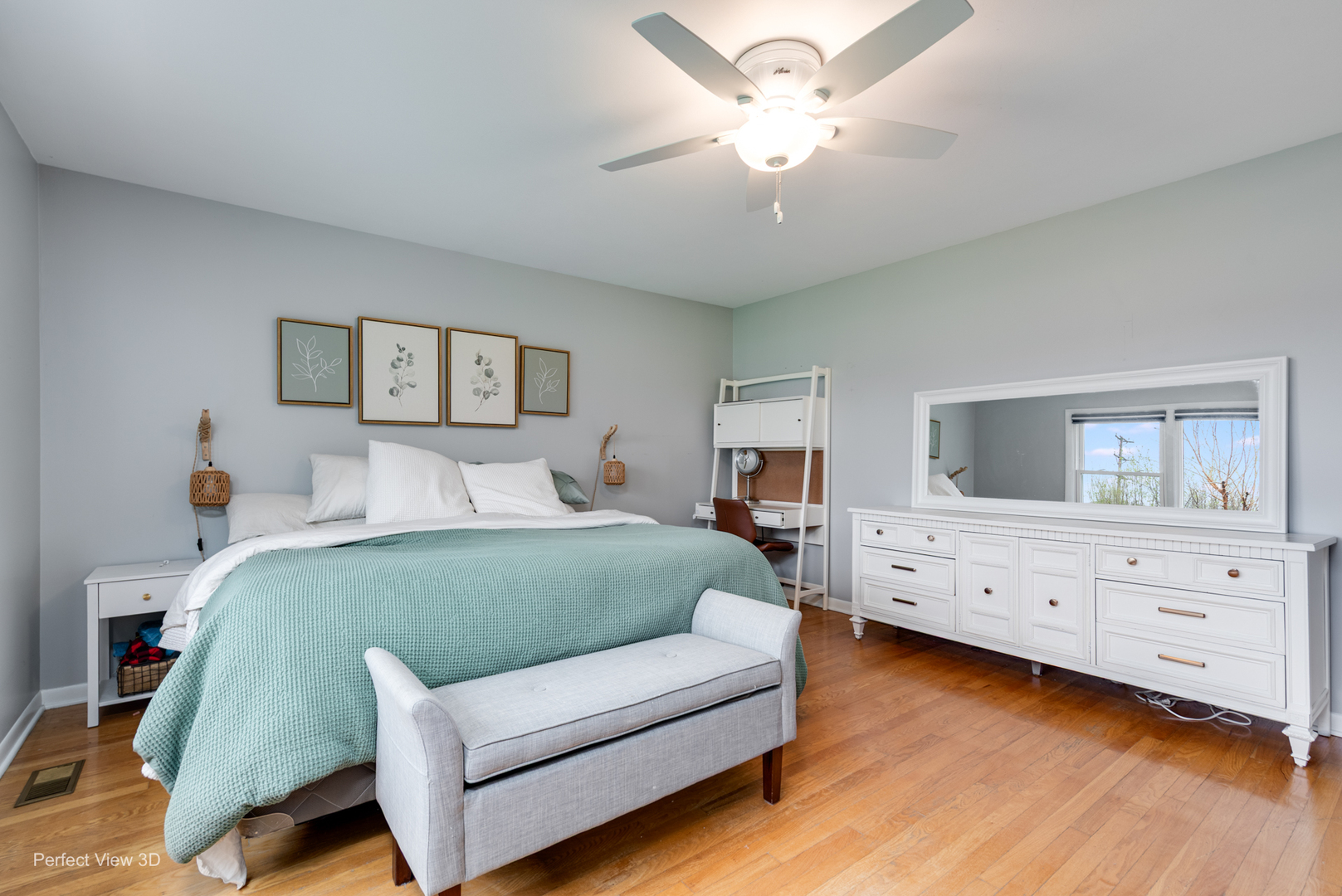1003 West Hintz Road Arlington Heights, IL 60004 - Photo 18 of 27 a spacious bedroom with a bed and a dresser
