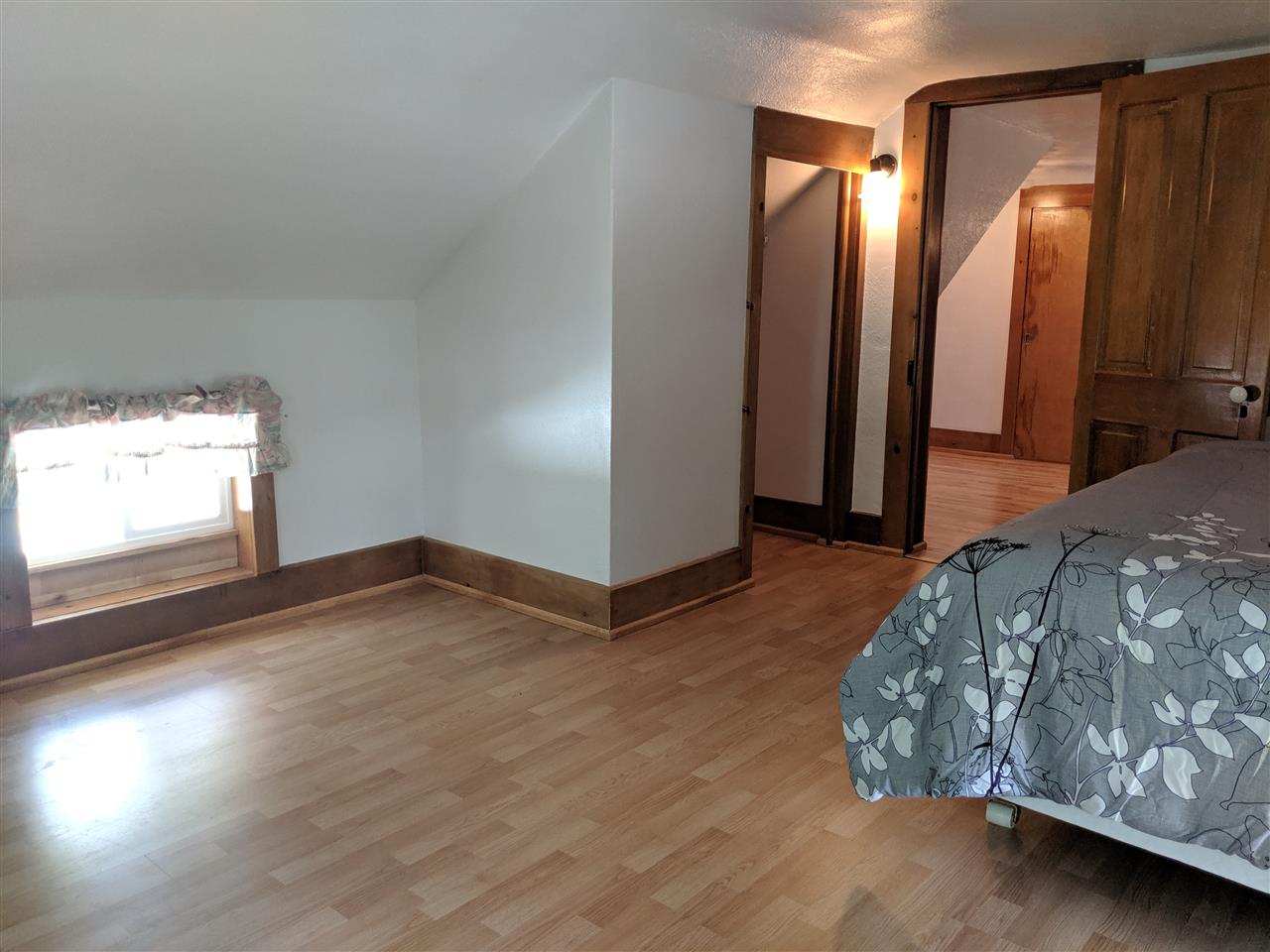1091 West Buckeye Road Freeport, IL 61032 - Photo 17 of 25 a bedroom with a bed and a mirror