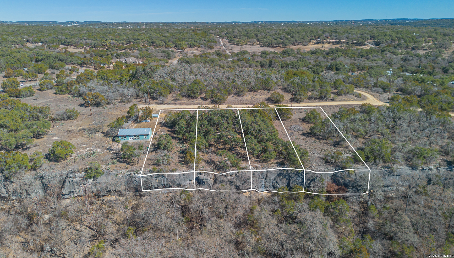 1076 Blue Bonnet Hl Drive Spring Branch, TX 78070 - Photo 20 of 44 an aerial view of a house with a yard