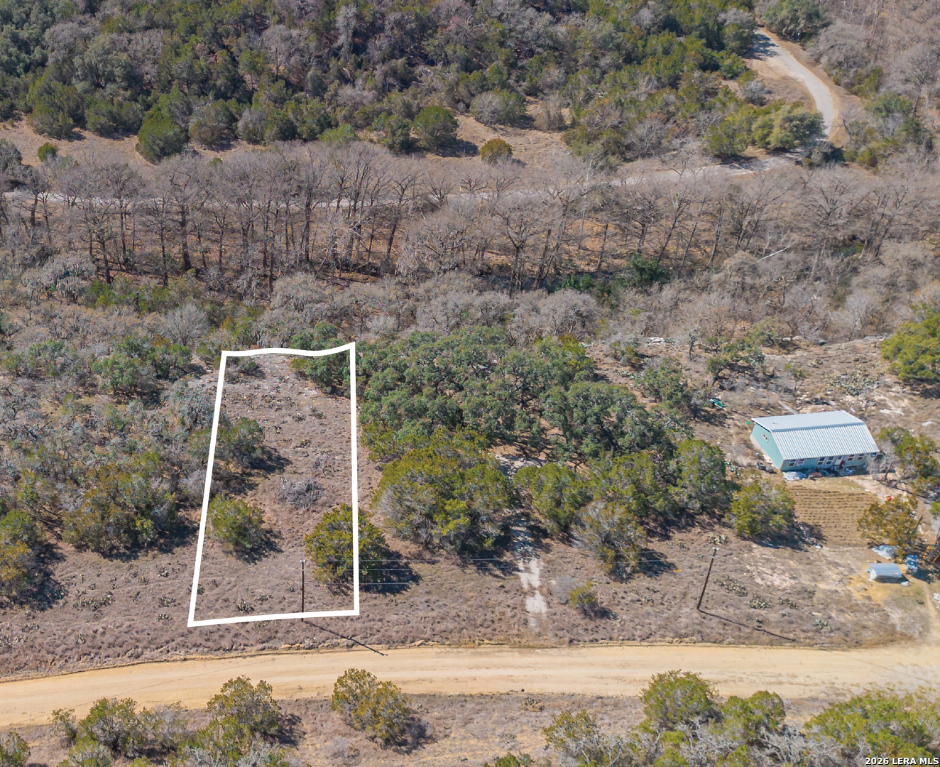 1076 Blue Bonnet Hl Drive Spring Branch, TX 78070 - Photo 3 of 44 a backyard of a house