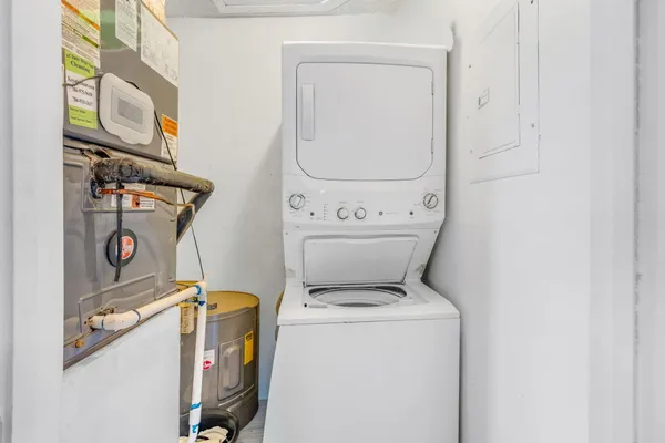 a view of a chair and tables in the patio
