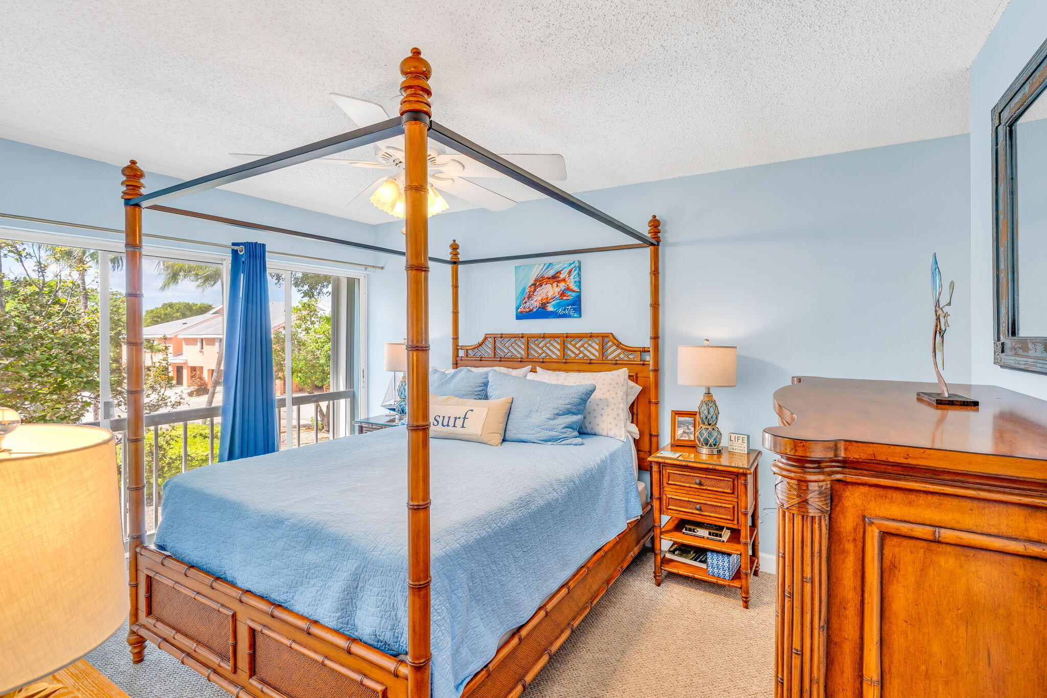 98422 Windward Avenue Key Largo, FL 33037 - Photo 13 of 44 a bedroom with a bed and wooden floor