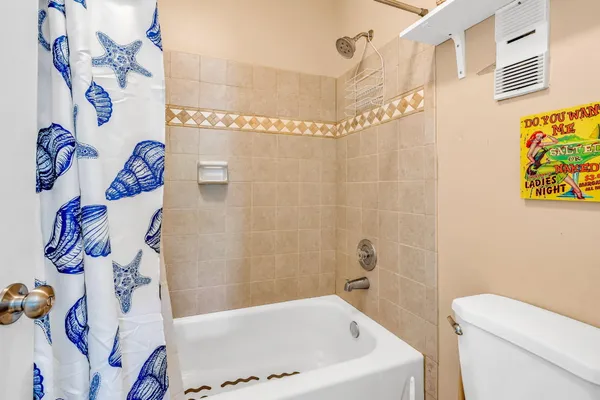 a front view of a house with a yard and outdoor seating