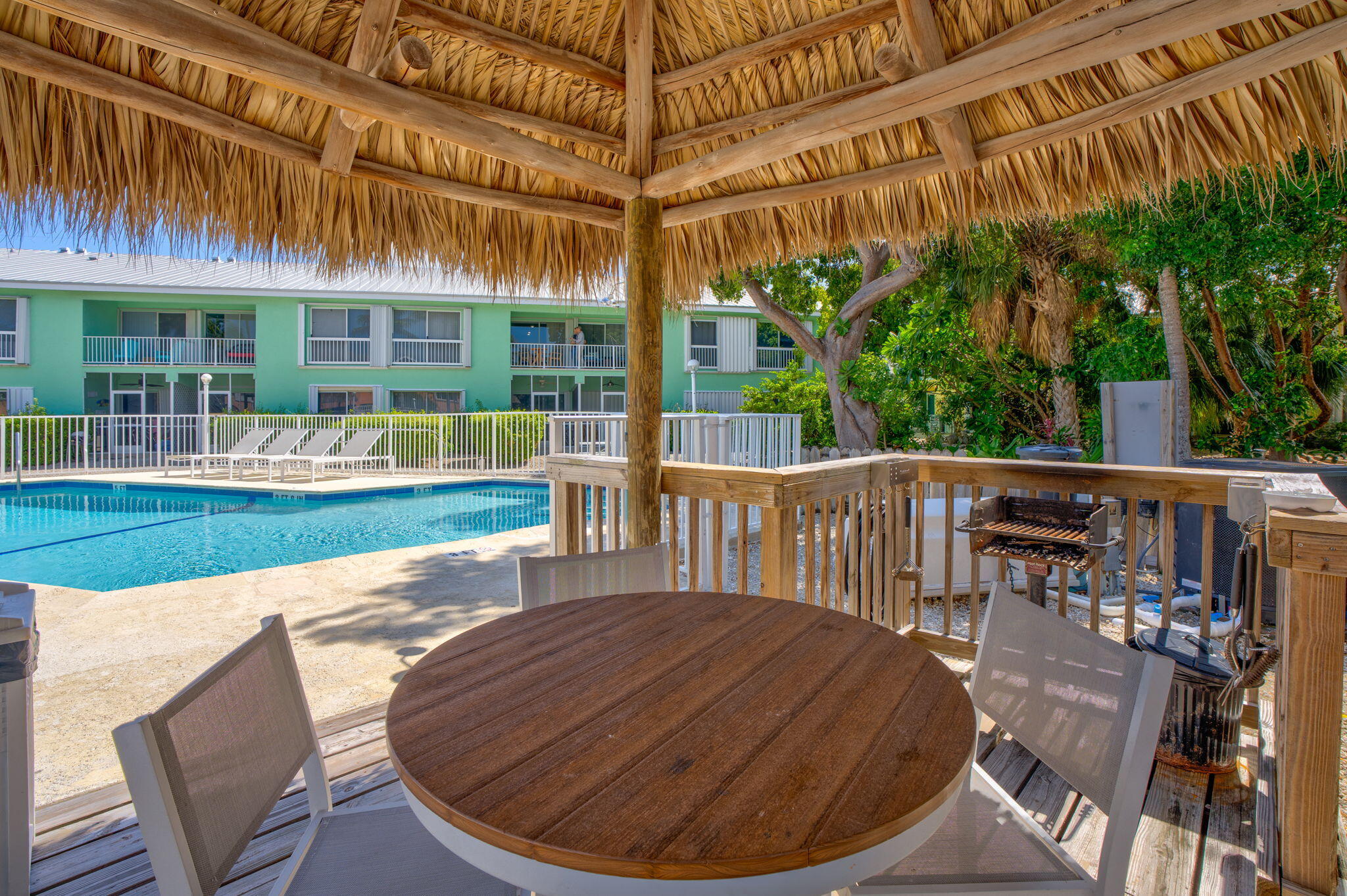 98422 Windward Avenue Key Largo, FL 33037 - Photo 24 of 44 a view of a chair and tables in the patio