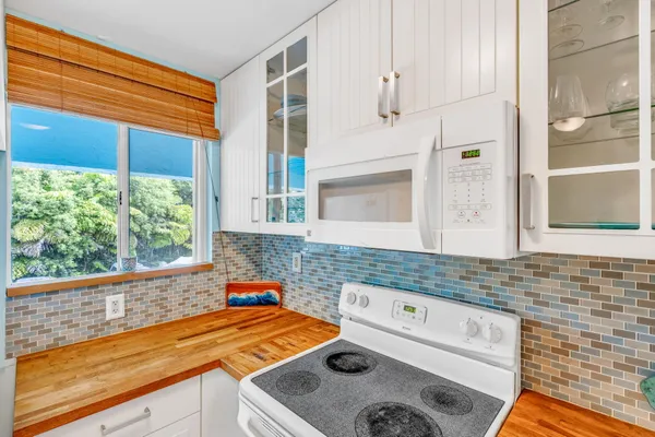 a white refrigerator freezer sitting inside of a kitchen