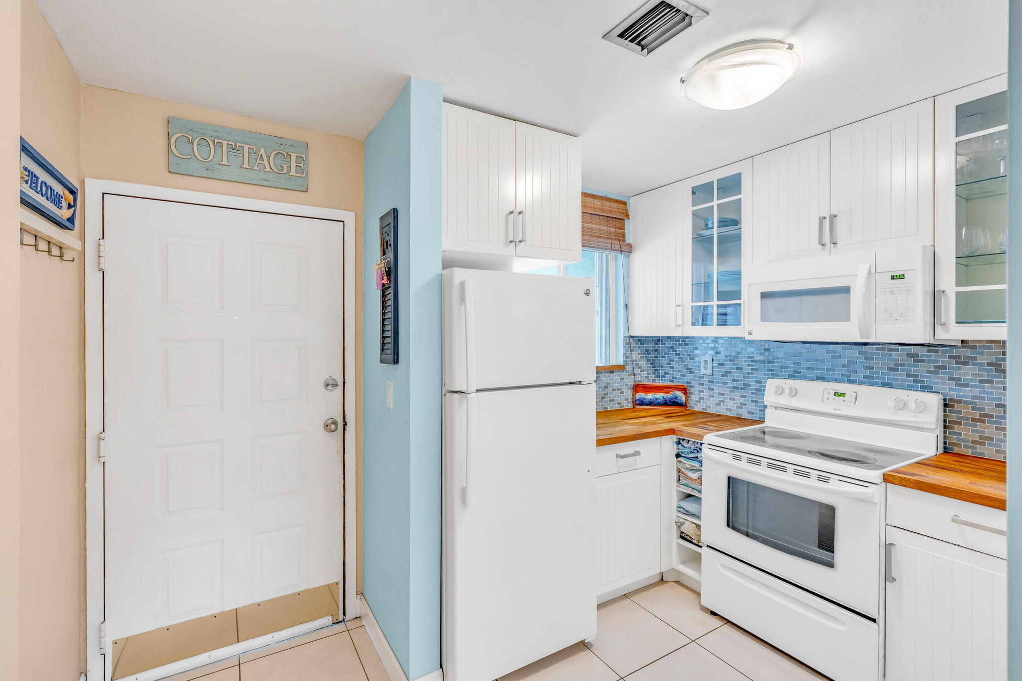 98422 Windward Avenue Key Largo, FL 33037 - Photo 4 of 44 a white refrigerator freezer sitting inside of a kitchen