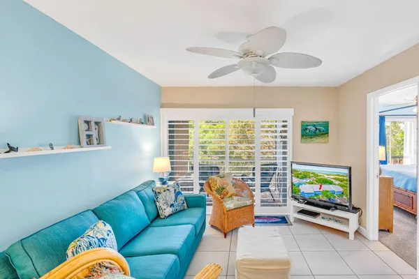 a living room with dining table and wooden floor