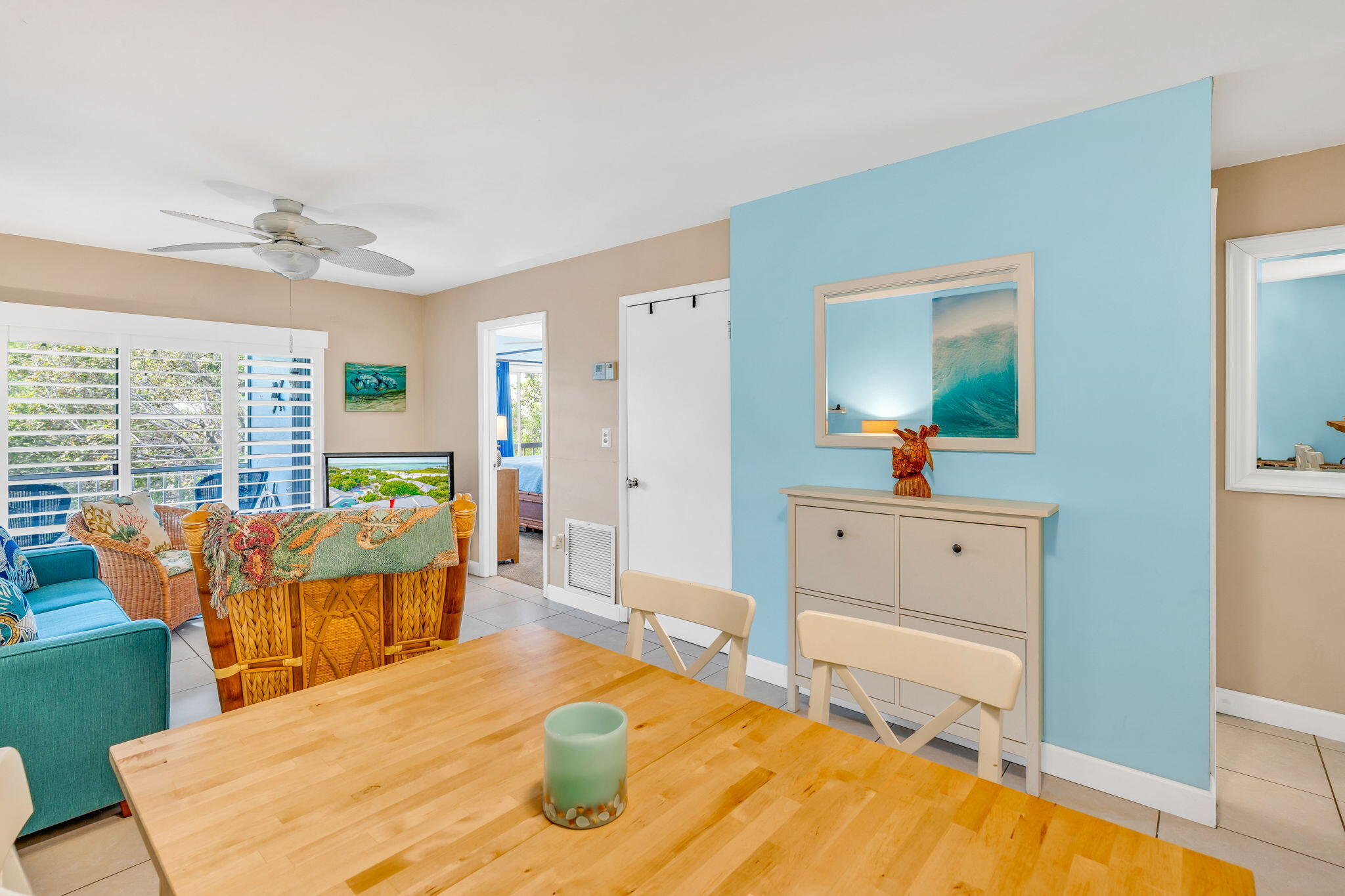 98422 Windward Avenue Key Largo, FL 33037 - Photo 10 of 44 a living room with dining table and wooden floor