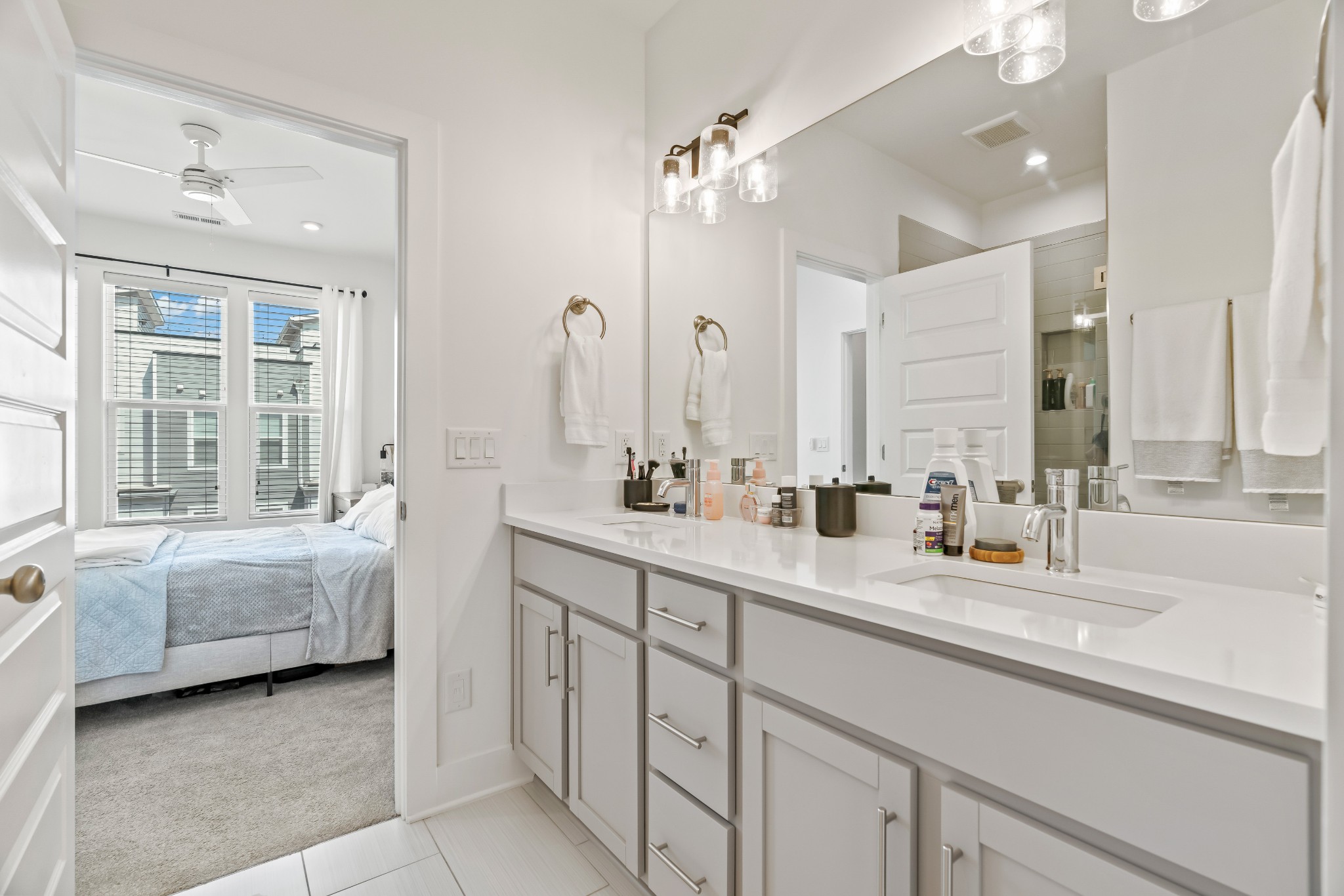 500 Creative Way, Unit 11 Madison, TN 37115 - Photo 12 of 18 a bathroom with double vanity sinks and a large mirror