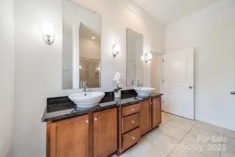 a bath room with a sink and a mirror