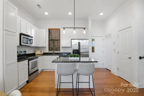 a kitchen with counter top space cabinets and stainless steel appliances