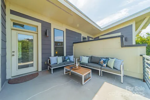 a outdoor living space with furniture and a potted plant