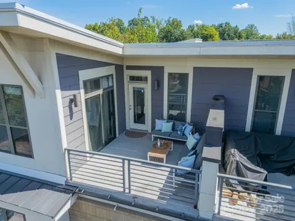 a view of a balcony with chairs