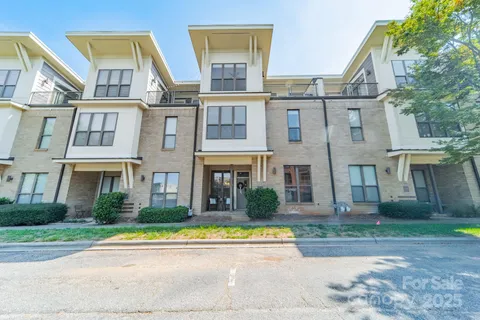 a view of building with a swimming pool