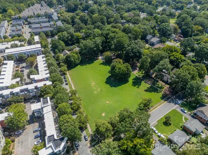 an aerial view of residential house with outdoor space and swimming pool