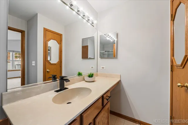 a bathroom with a sink and a mirror
