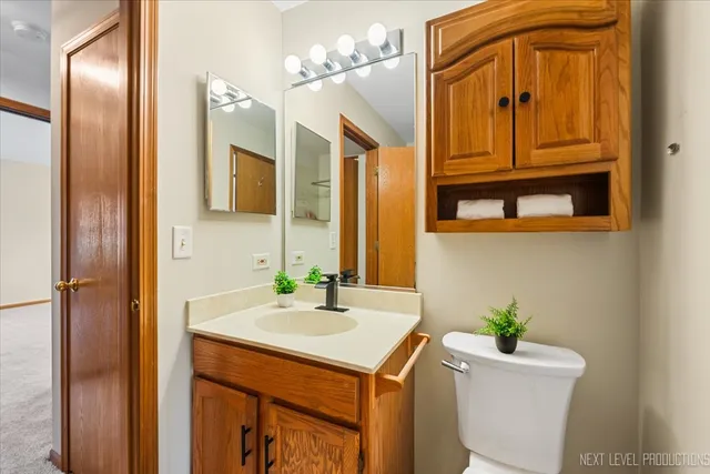 a bathroom with a sink a vanity and a mirror