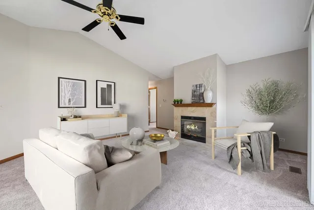 a living room with furniture and a fireplace