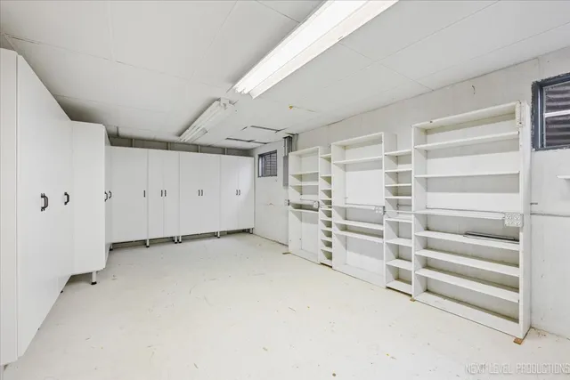 a view of an empty room with white walls