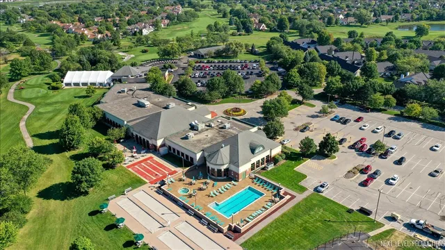 an aerial view of multiple houses with yard