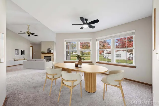 a dining room with furniture and window