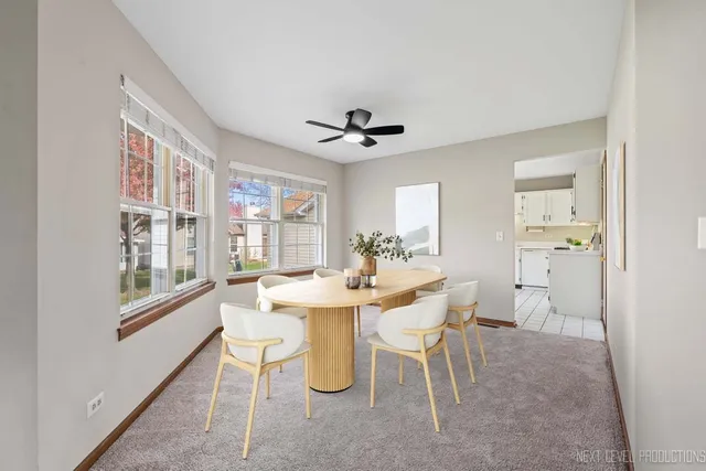 a dining room with furniture and window