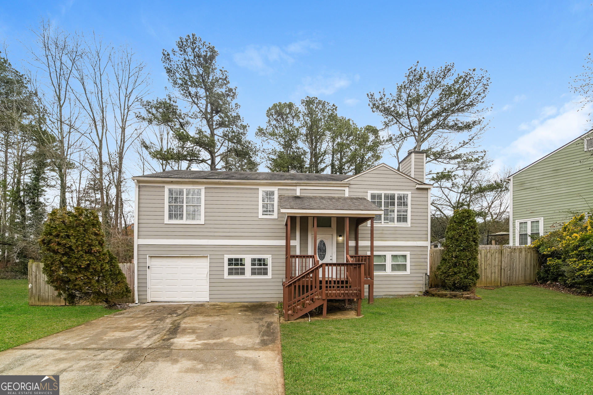 1398 Ling Drive Austell, GA 30168 - Photo 1 of 1 a front view of house with yard and trees in the background