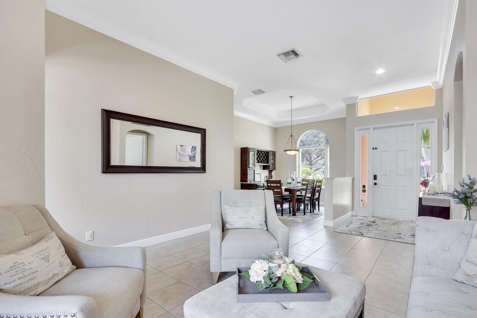 146 Magnolia Way Tequesta, FL 33469 - Photo 14 of 81 a living room with furniture and a large window