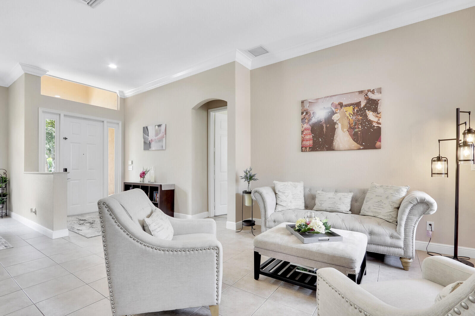 146 Magnolia Way Tequesta, FL 33469 - Photo 15 of 81 a living room with furniture and a large window