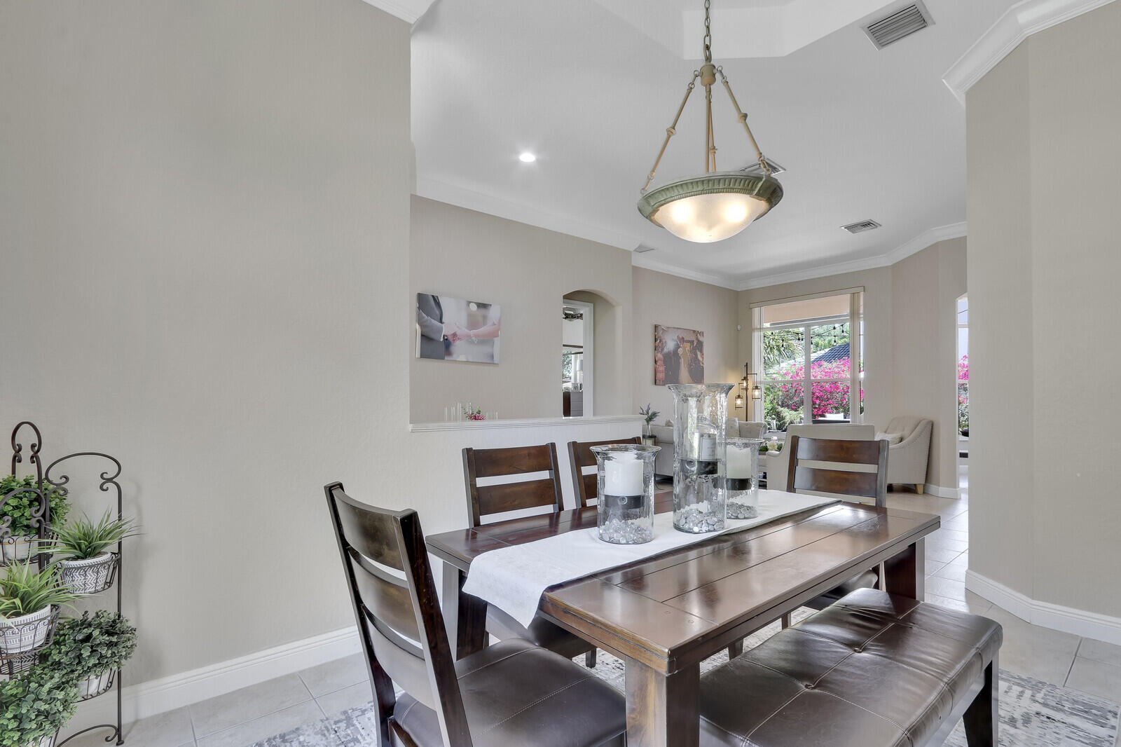 146 Magnolia Way Tequesta, FL 33469 - Photo 20 of 81 a view of a dining room with furniture and wooden floor