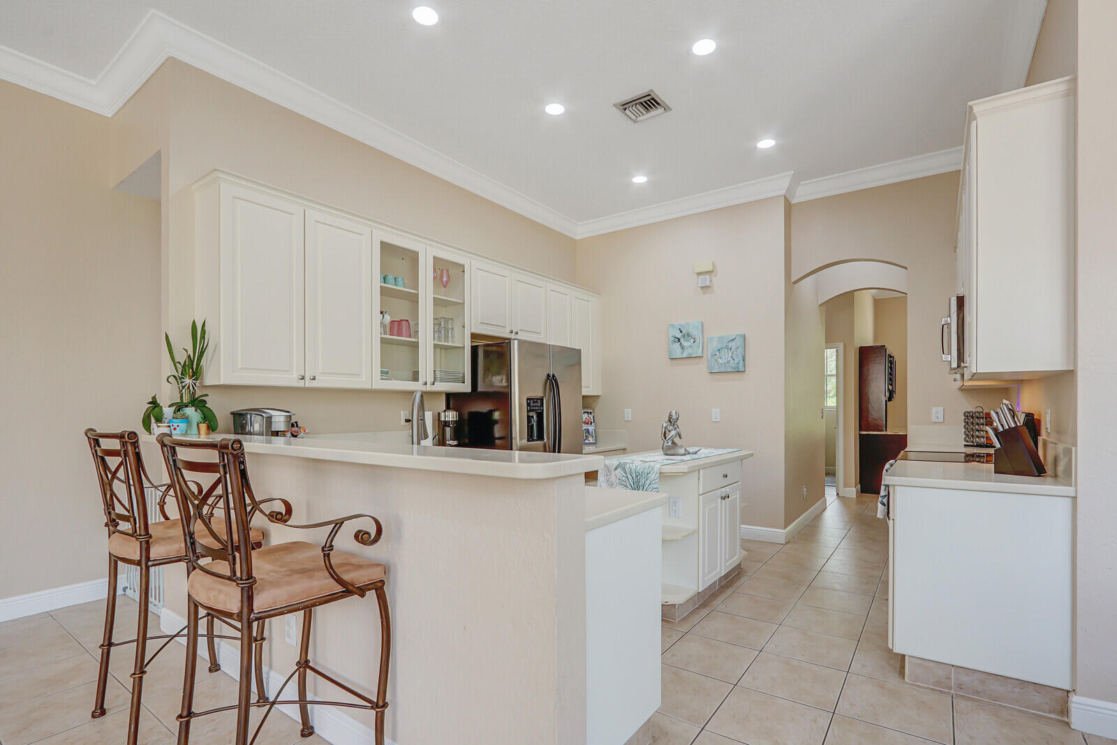 146 Magnolia Way Tequesta, FL 33469 - Photo 22 of 81 a kitchen with counter top space cabinets and appliances