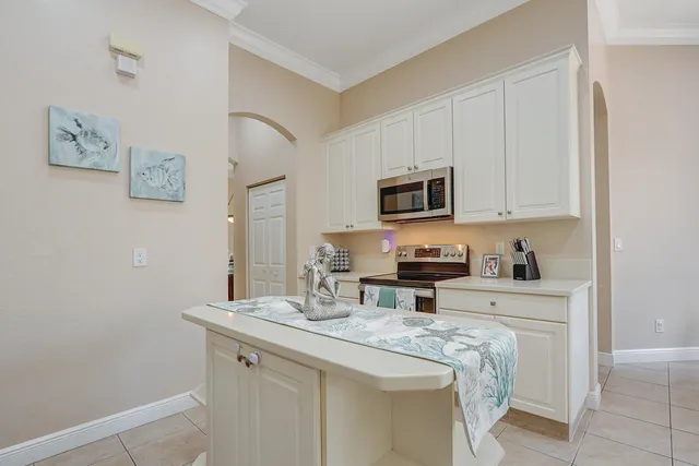an aerial view of a house with a garden and a yard