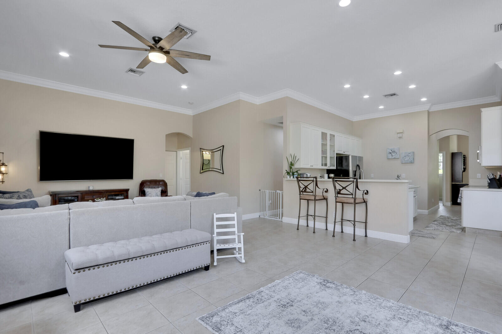 146 Magnolia Way Tequesta, FL 33469 - Photo 31 of 81 a living room with furniture and a flat screen tv