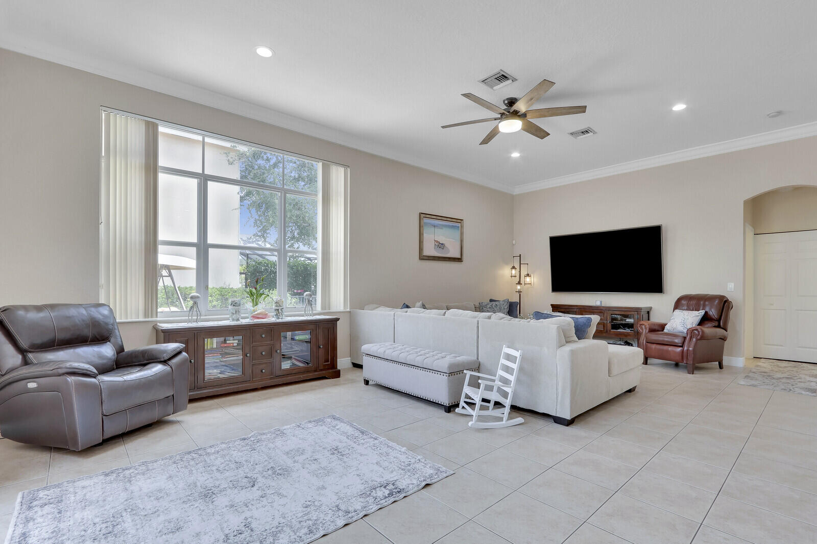 146 Magnolia Way Tequesta, FL 33469 - Photo 32 of 81 a living room with furniture and a flat screen tv