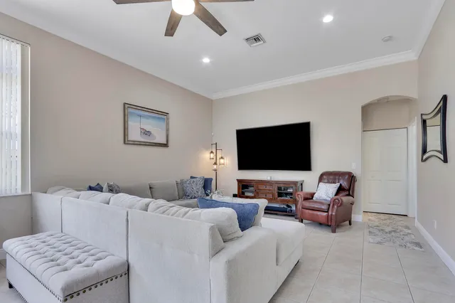 an aerial view of residential houses with outdoor space and a lake view