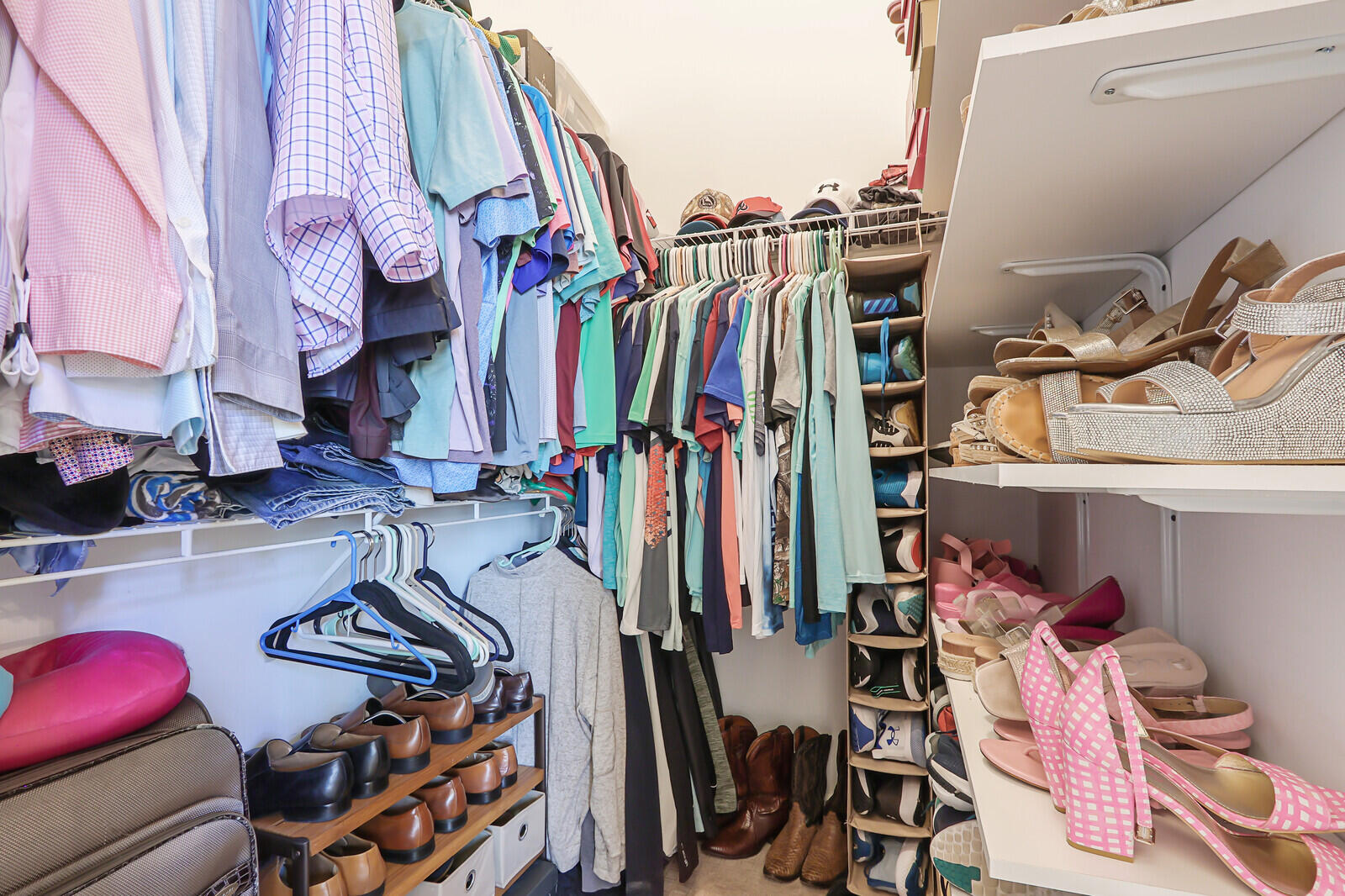 146 Magnolia Way Tequesta, FL 33469 - Photo 43 of 81 a view of walk in closet with clothes and shoes