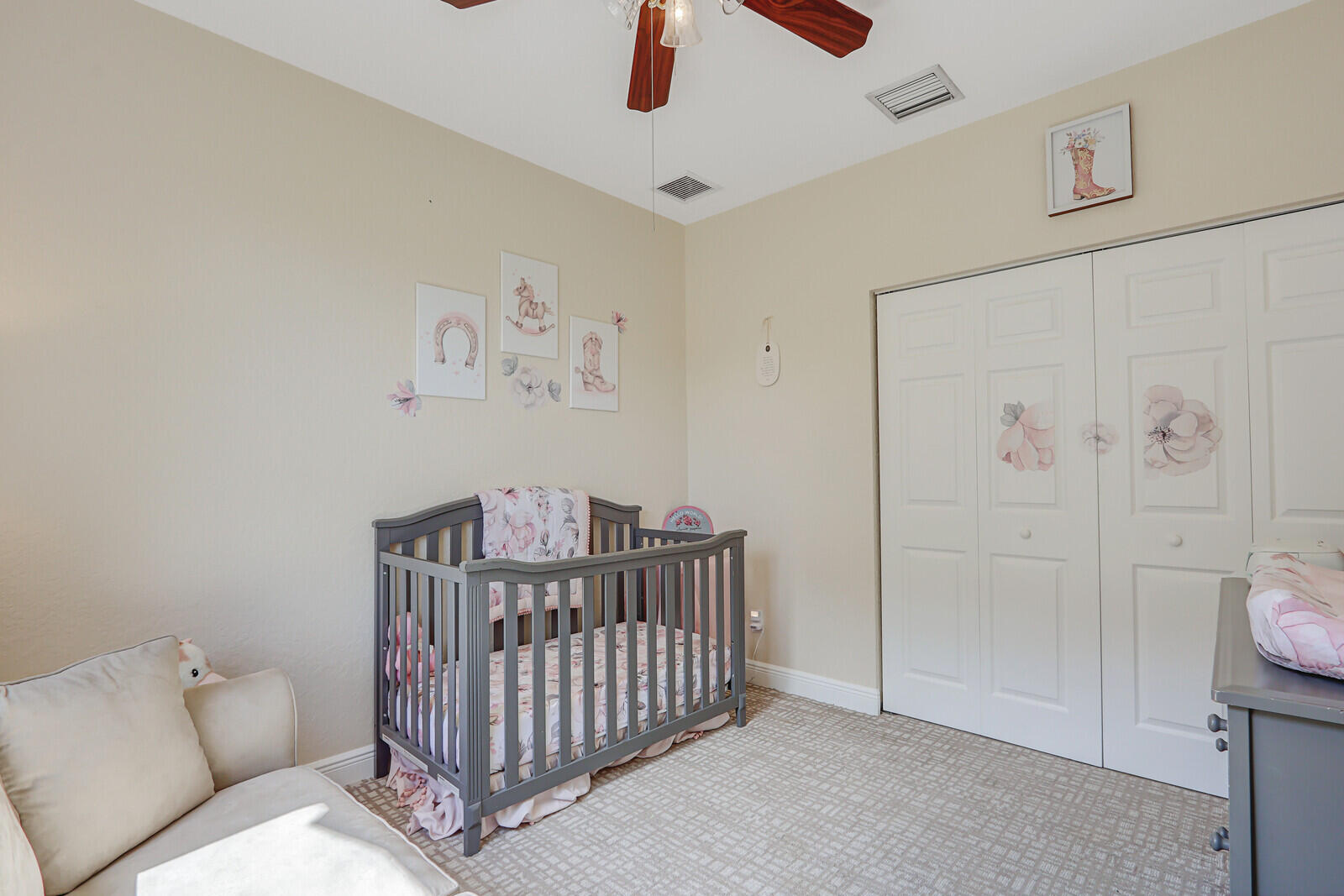 146 Magnolia Way Tequesta, FL 33469 - Photo 47 of 81 a bedroom with a bed and fan