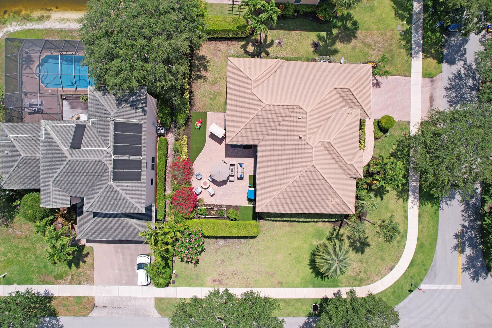 146 Magnolia Way Tequesta, FL 33469 - Photo 62 of 81 an aerial view of a house with a garden and a yard