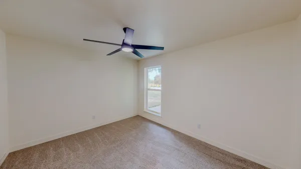a view of empty room with windows
