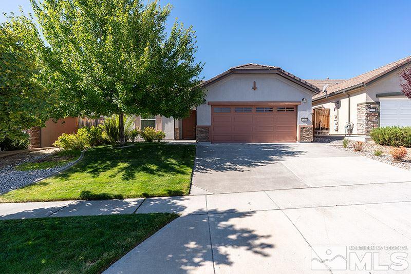 1365 Meridian Ranch Drive Reno, NV 89523 - Photo 1 of 18 a front view of a house with a yard and garage