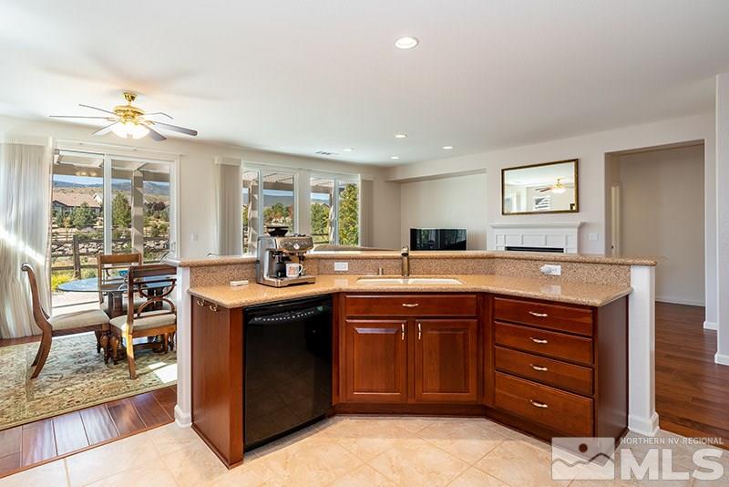 1365 Meridian Ranch Drive Reno, NV 89523 - Photo 17 of 18 a kitchen with a sink stove and chairs