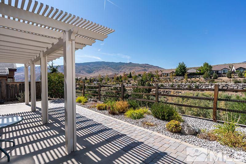 1365 Meridian Ranch Drive Reno, NV 89523 - Photo 8 of 18 a view of a balcony with wooden floor and city view