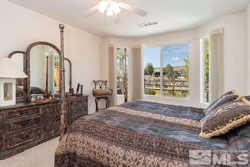 1365 Meridian Ranch Drive Reno, NV 89523 - Photo 9 of 18 a bedroom with a bed and a dresser