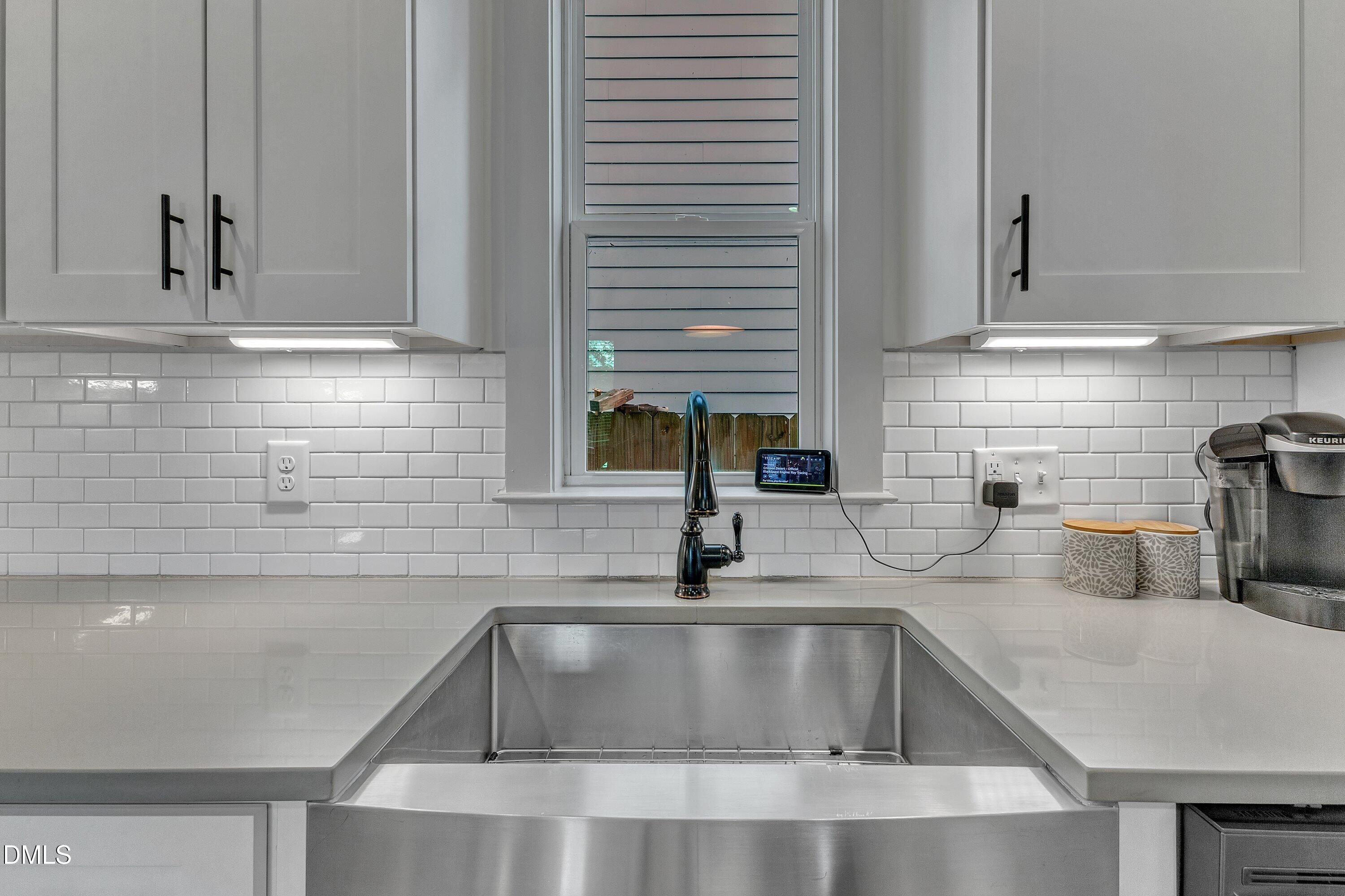 3 Maple Street Raleigh, NC 27610 - Photo 17 of 39 a kitchen with granite countertop a sink and a stove