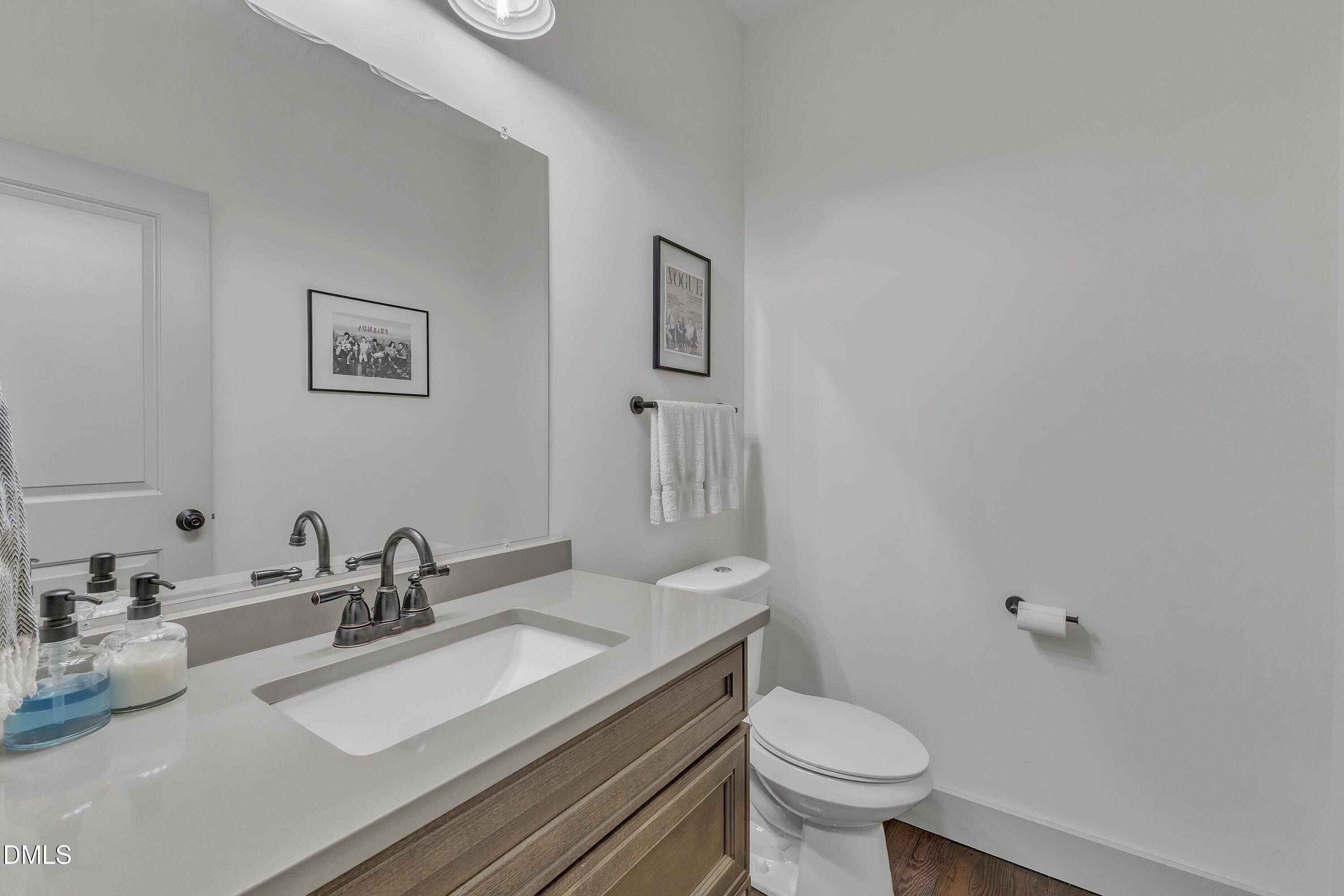 3 Maple Street Raleigh, NC 27610 - Photo 23 of 39 a bathroom with a toilet sink and mirror
